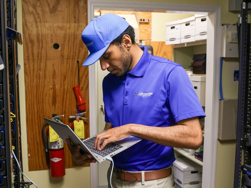 Technician running recovery checks in the data closet
