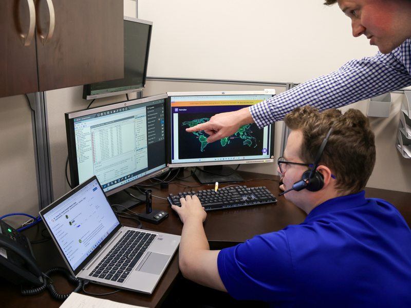 IT staff responding to alerts on a threat map
