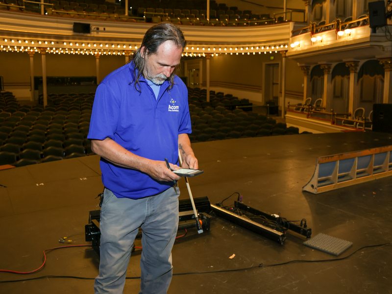 Technician recording inspection notes