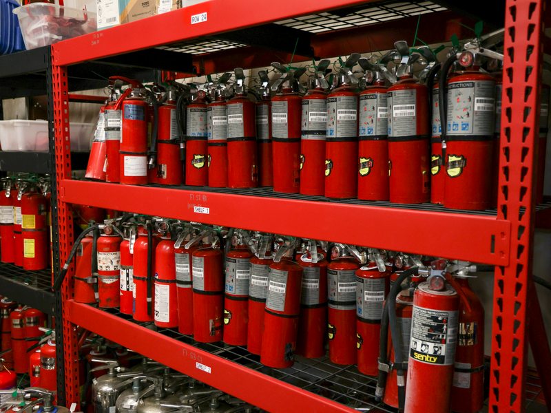 Shelves stocked with new extinguishers