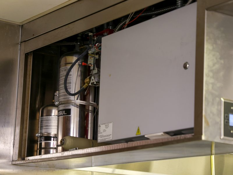 Suppression system tanks in cabinet