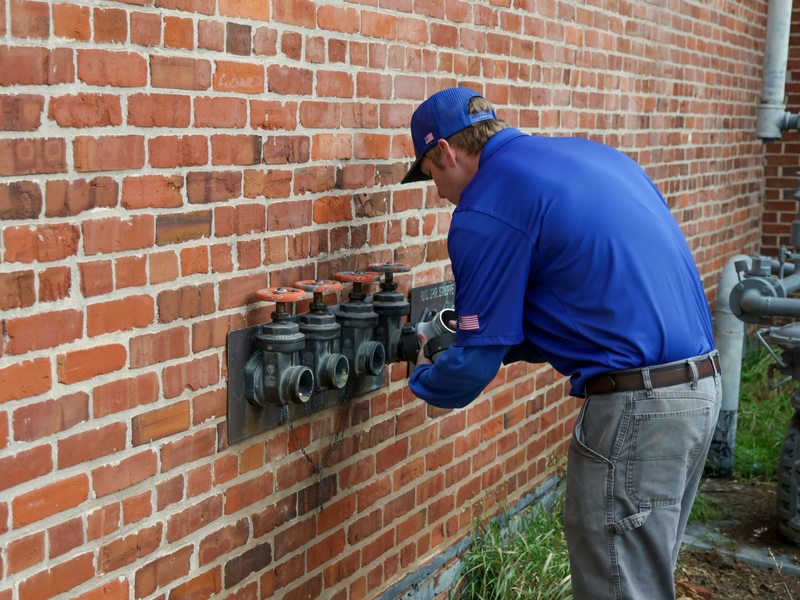 Technician at standpipe valves