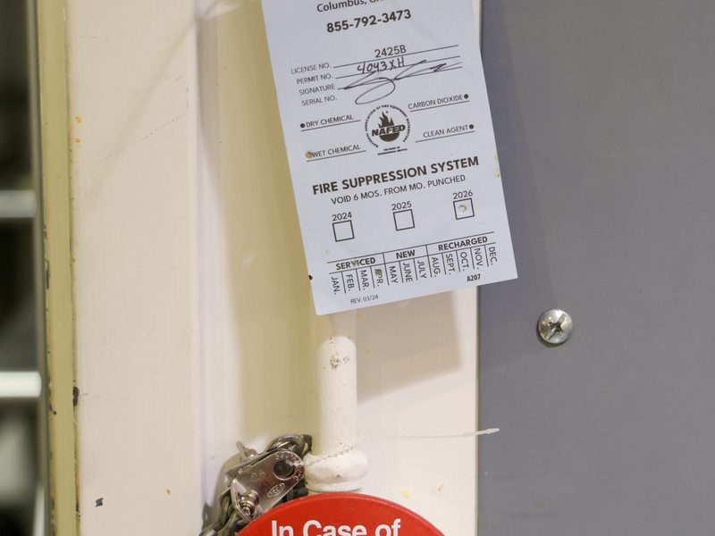 Suppression pull station with inspection tag