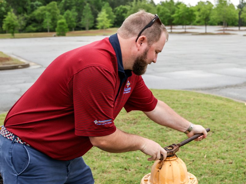 Technician wrenching the hydrant during service