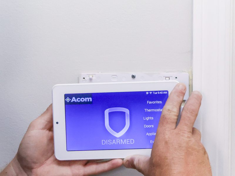 Acom panel listing thermostat and lighting controls