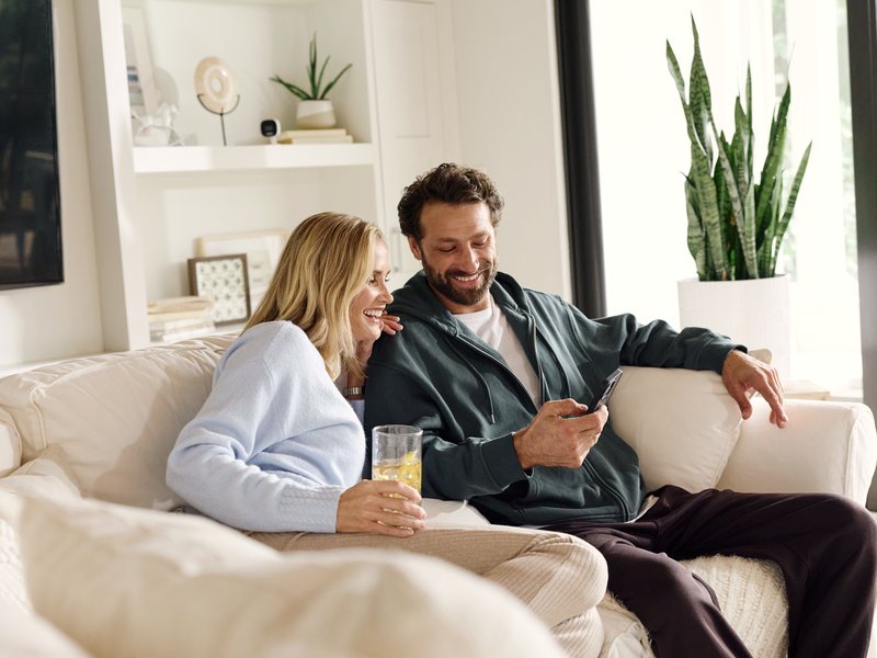 Couple relaxing in a warmly lit living room