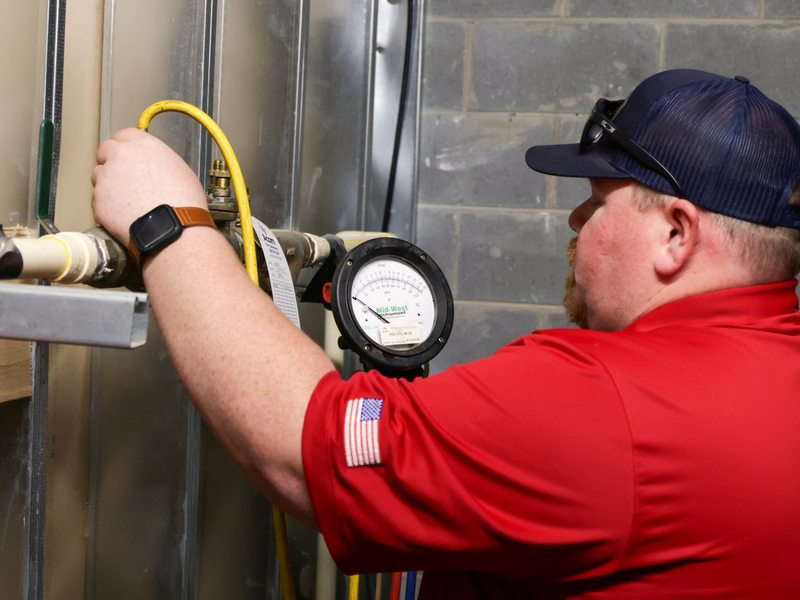 Reading the pressure gauge during a sprinkler test