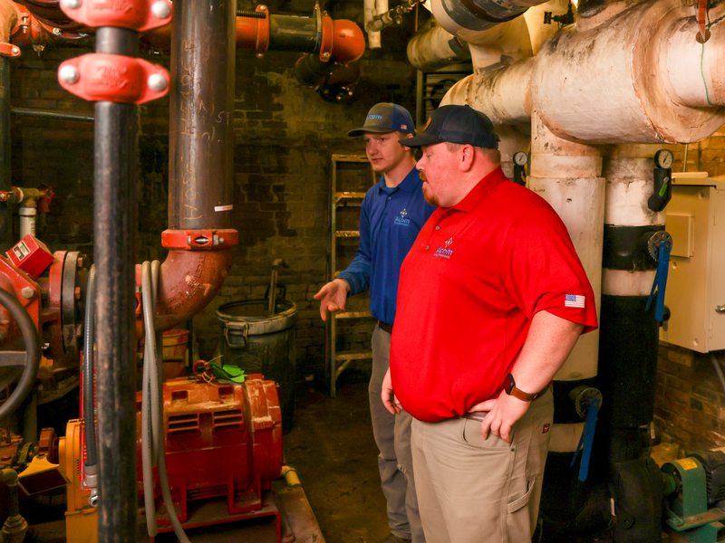 Technicians inspecting the fire pump