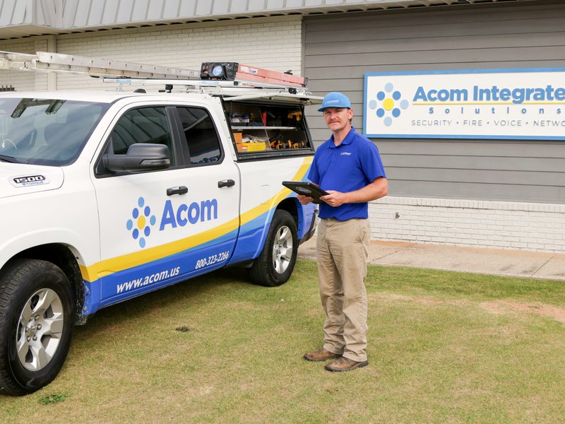 Acom technician working from the field with a tablet