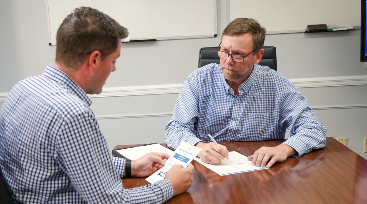 Acom rep walking a business owner through the inspection program