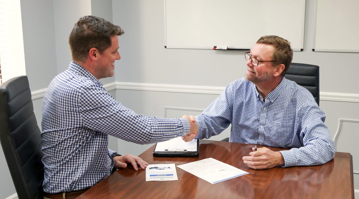 Safety director reviewing a campus system with an Acom technician